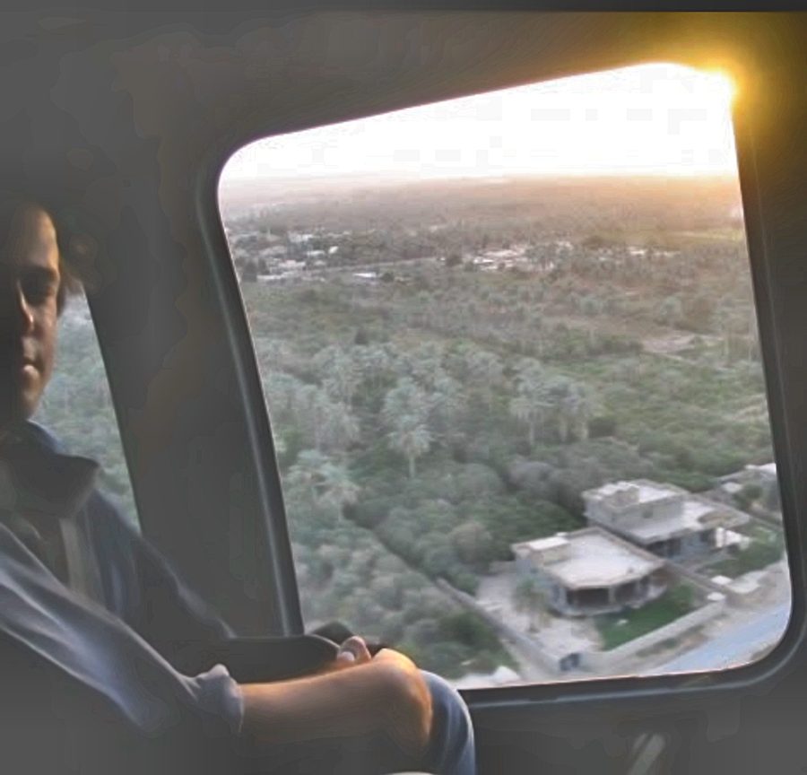 Helicopter over palm groves